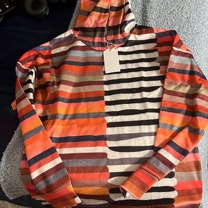 This is a small hoodie. Definitely for a small frame. But very cute.